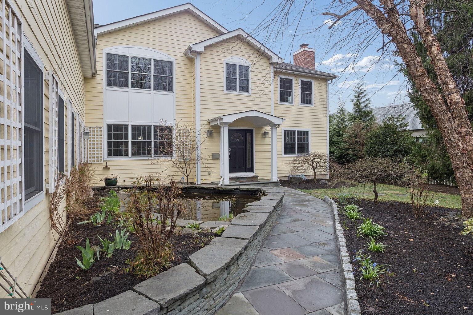 29 Dempsey Avenue Princeton, NJ 08540 - Photo 3 of 58 a front view of a house with garden