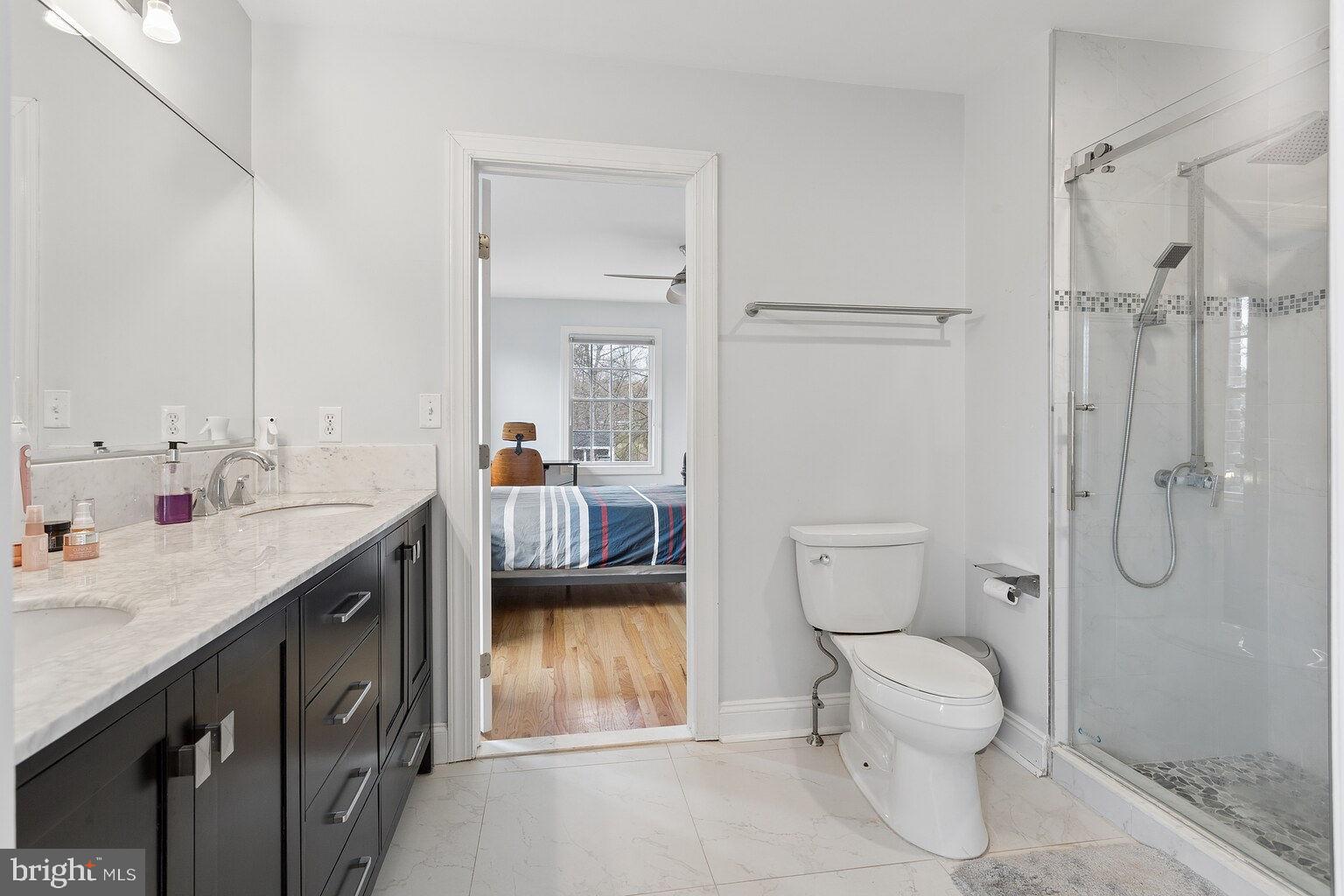 29 Dempsey Avenue Princeton, NJ 08540 - Photo 48 of 58 a en suite bathroom with a granite countertop sink toilet and shower