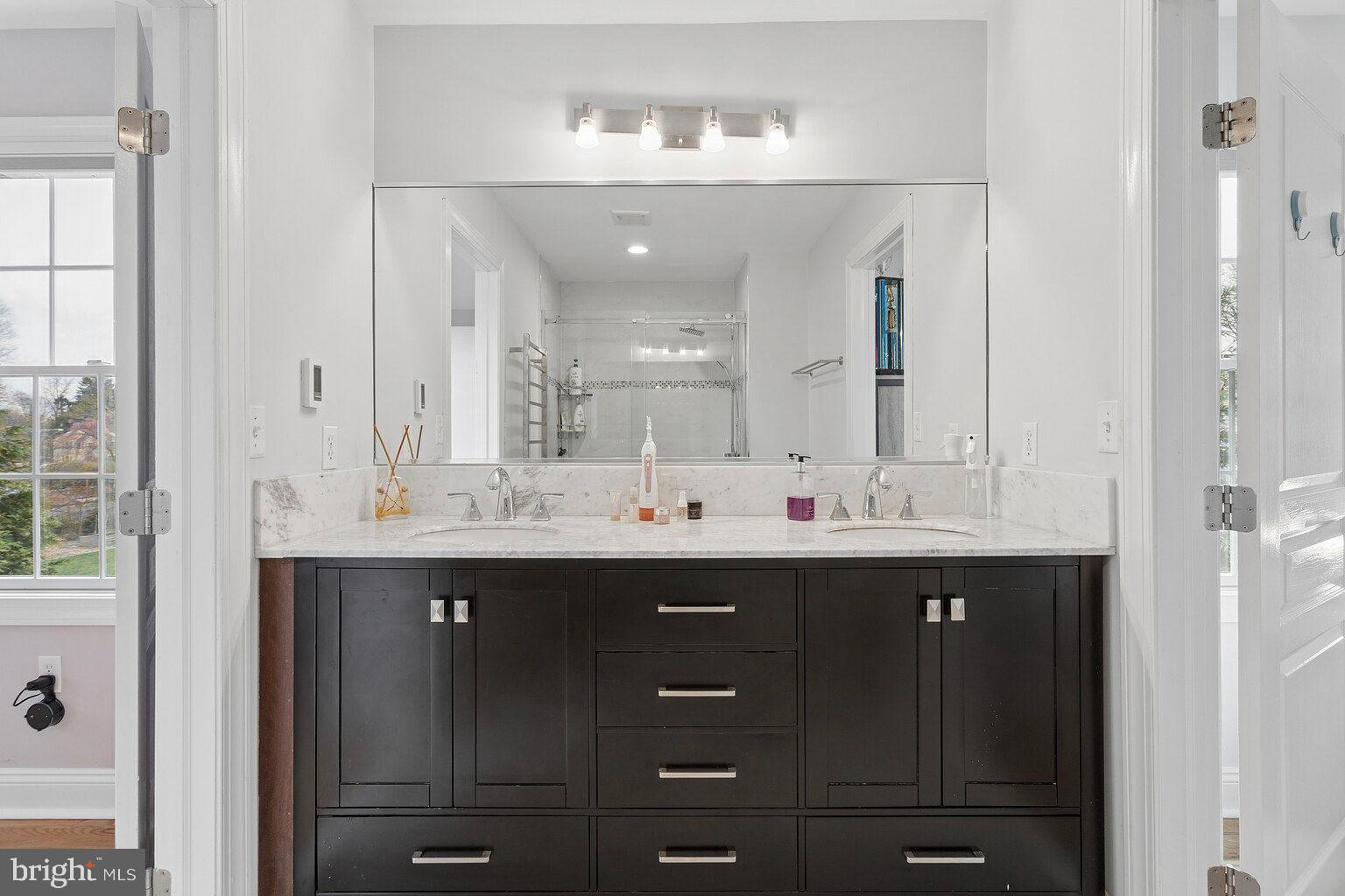 29 Dempsey Avenue Princeton, NJ 08540 - Photo 49 of 58 a bathroom with a double vanity sink and mirror