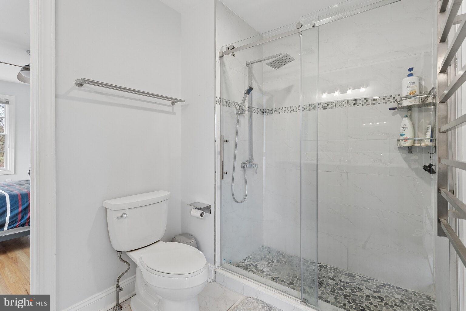 29 Dempsey Avenue Princeton, NJ 08540 - Photo 50 of 58 a bathroom with a granite countertop toilet a sink and shower
