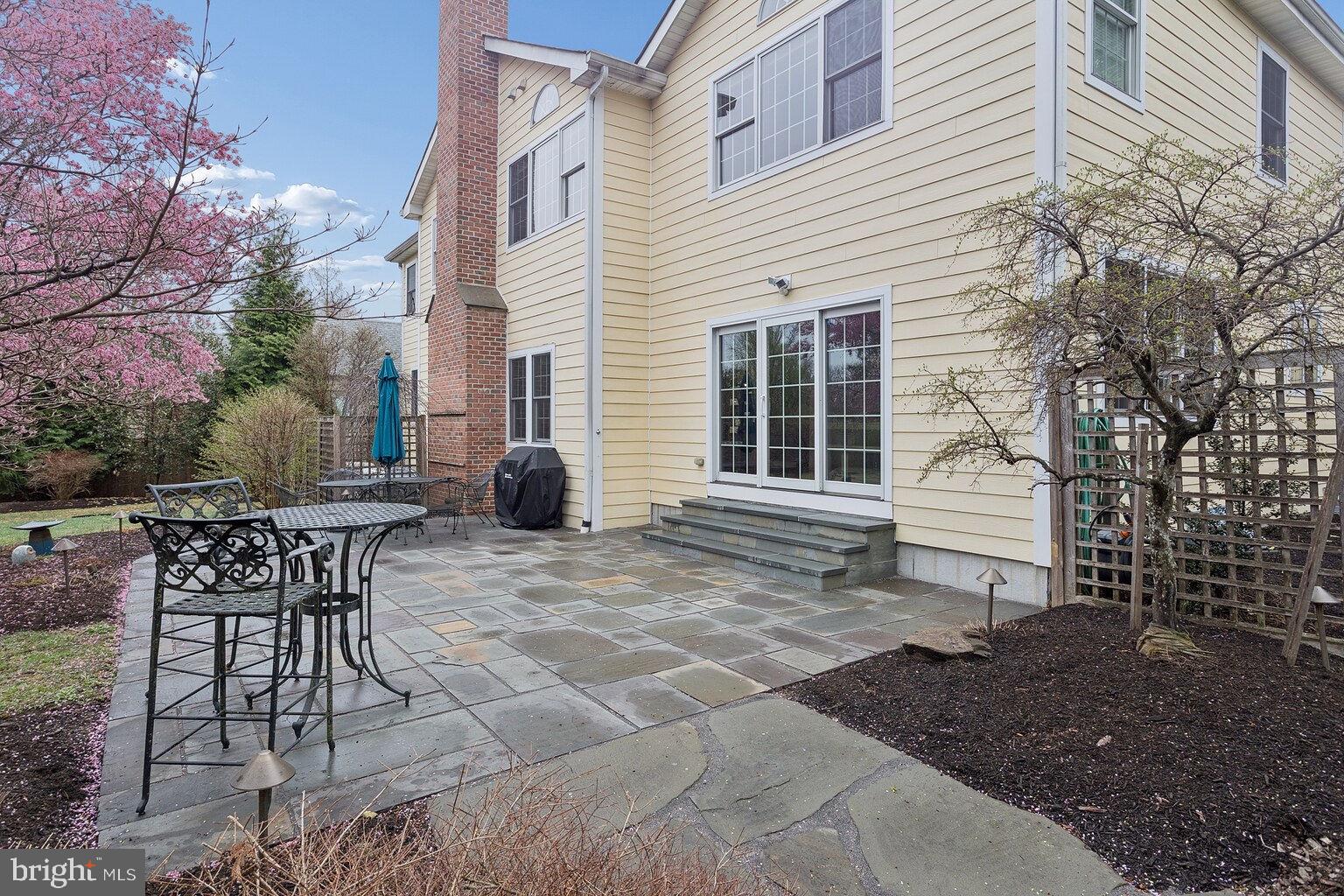 29 Dempsey Avenue Princeton, NJ 08540 - Photo 57 of 58 a backyard of a house with table and chairs