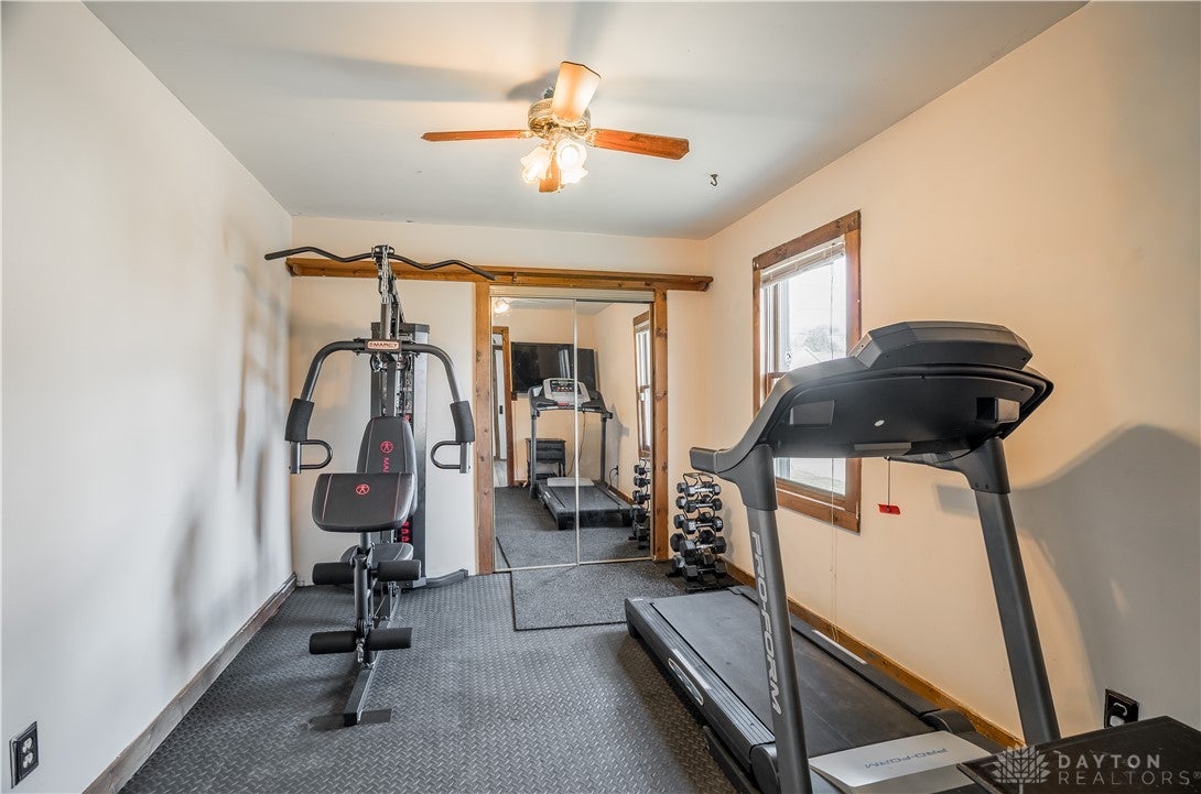 220 Racer Street Troy, OH 45373 - Photo 7 of 33 A bedroom serves as an inviting exercise room featuring durable flooring.