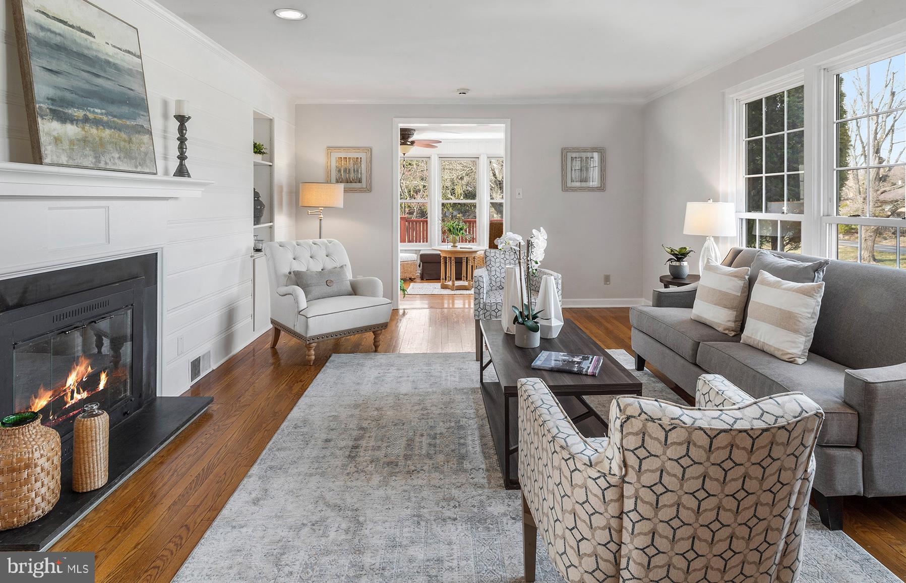 717 Woodfield Road Villanova, PA 19085 - Photo 3 of 32 Family room with fireplace to large sun room