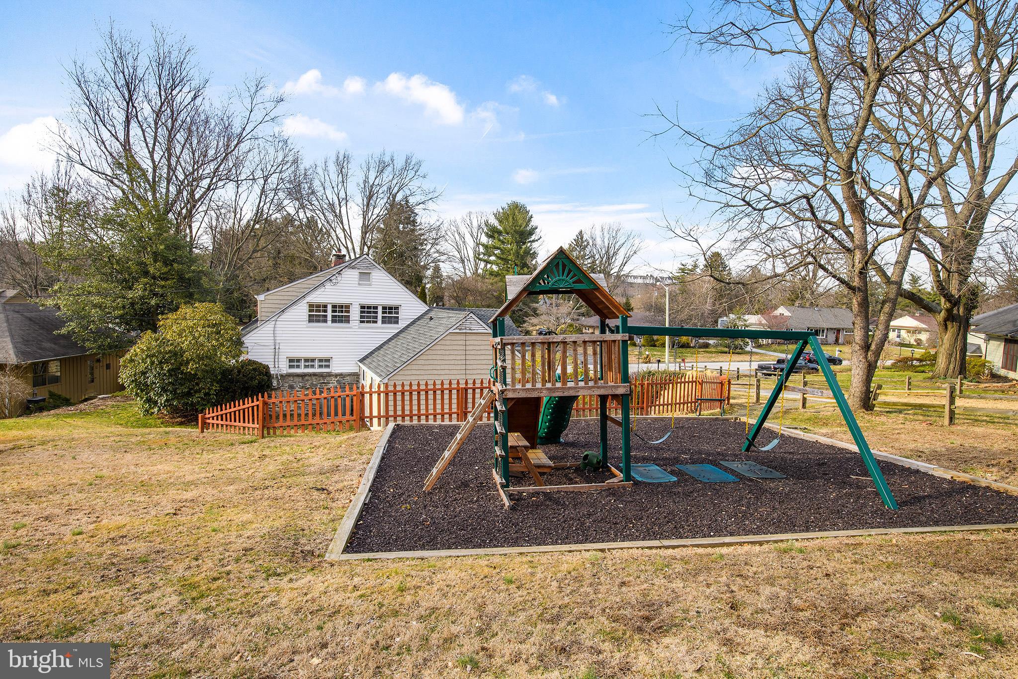 717 Woodfield Road Villanova, PA 19085 - Photo 28 of 32 Large side yard with playground and grassy area
