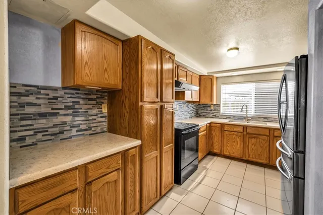 a utility room with sink dryer and washer