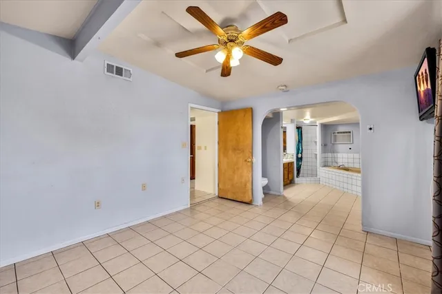 a bathroom with a tub a double vanity sink and mirror