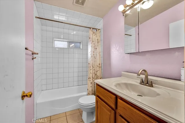 a bathroom with a sink a mirror and a toilet
