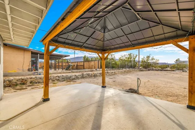 a patio with a table and chairs