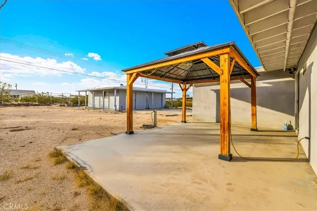 a house view with a backyard space