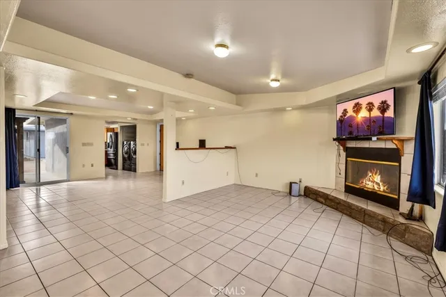 a view of an empty room with a fireplace