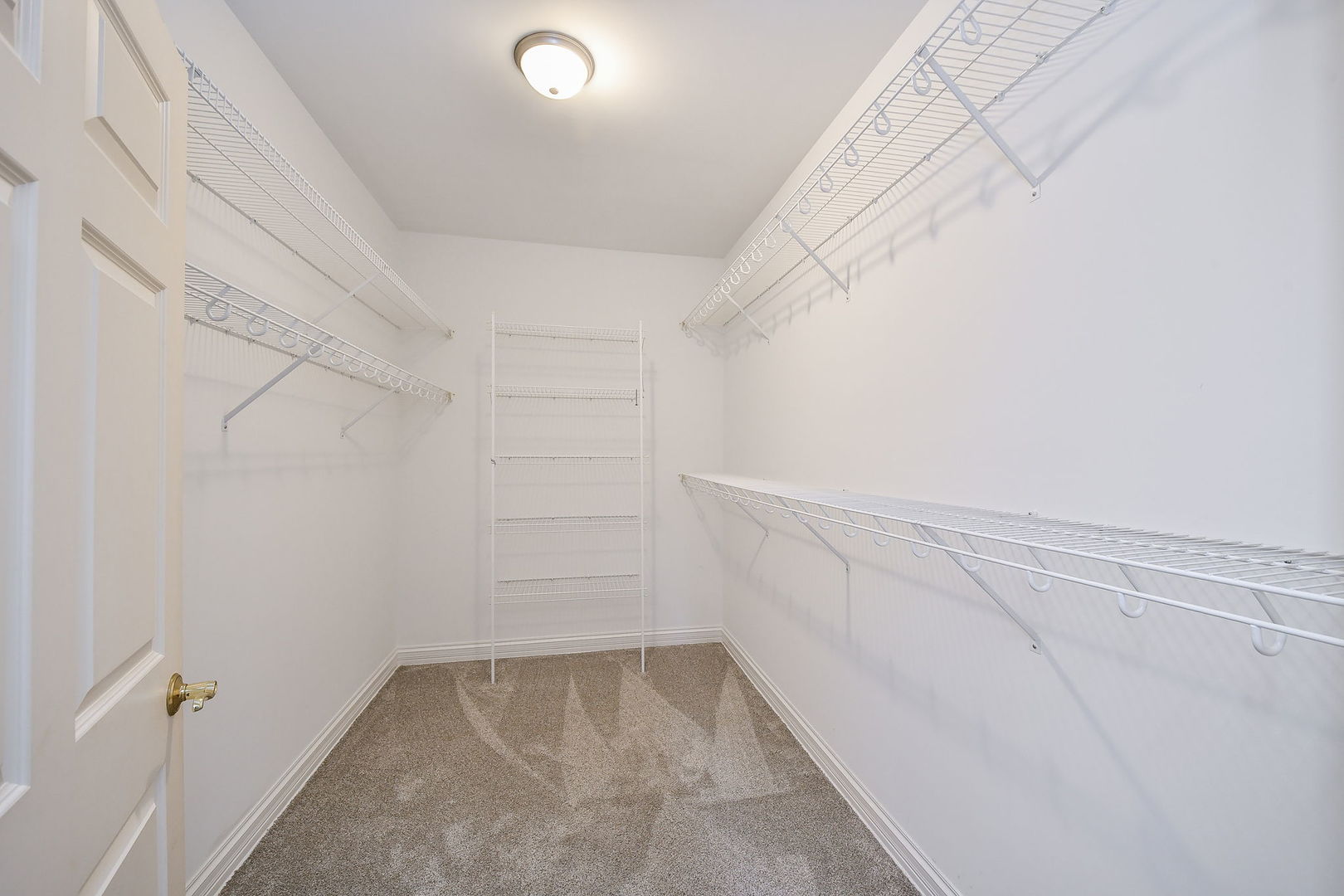 325 Delnor Glen Drive, Unit 325 St. Charles, IL 60174 - Photo 12 of 19 a view of a room with racks on the wall