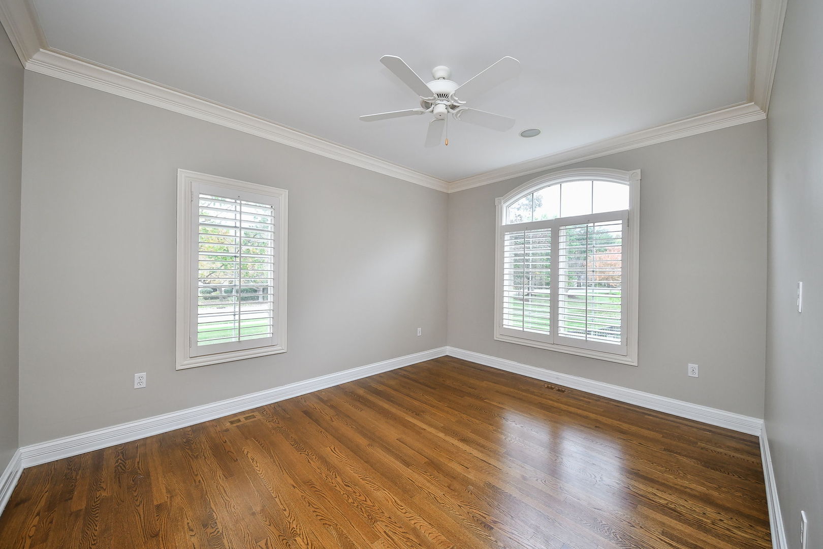 325 Delnor Glen Drive, Unit 325 St. Charles, IL 60174 - Photo 2 of 19 a view of an empty room with a window and wooden floor