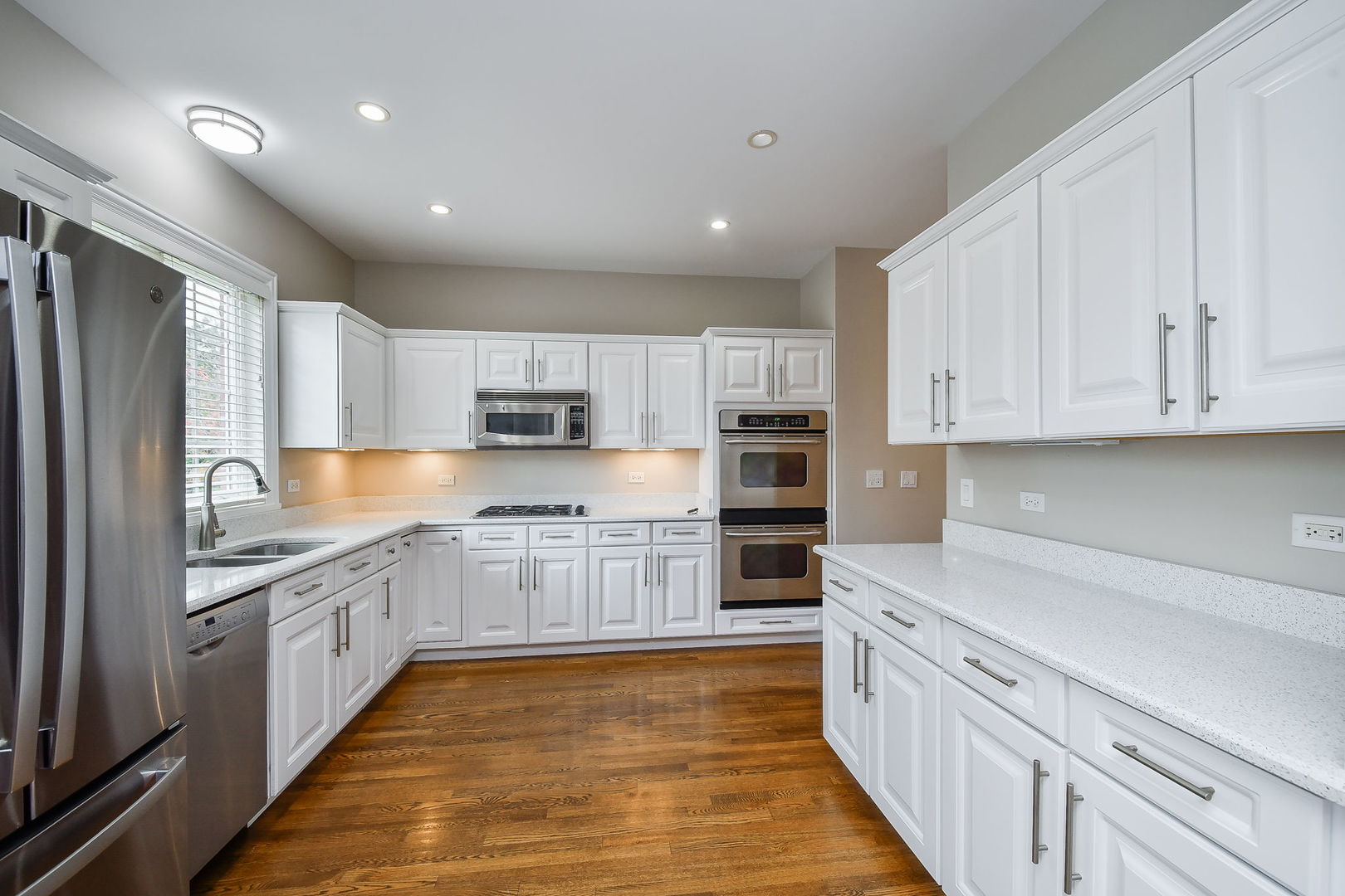 325 Delnor Glen Drive, Unit 325 St. Charles, IL 60174 - Photo 7 of 19 a large kitchen with stainless steel appliances granite countertop a large counter top and a stove top oven