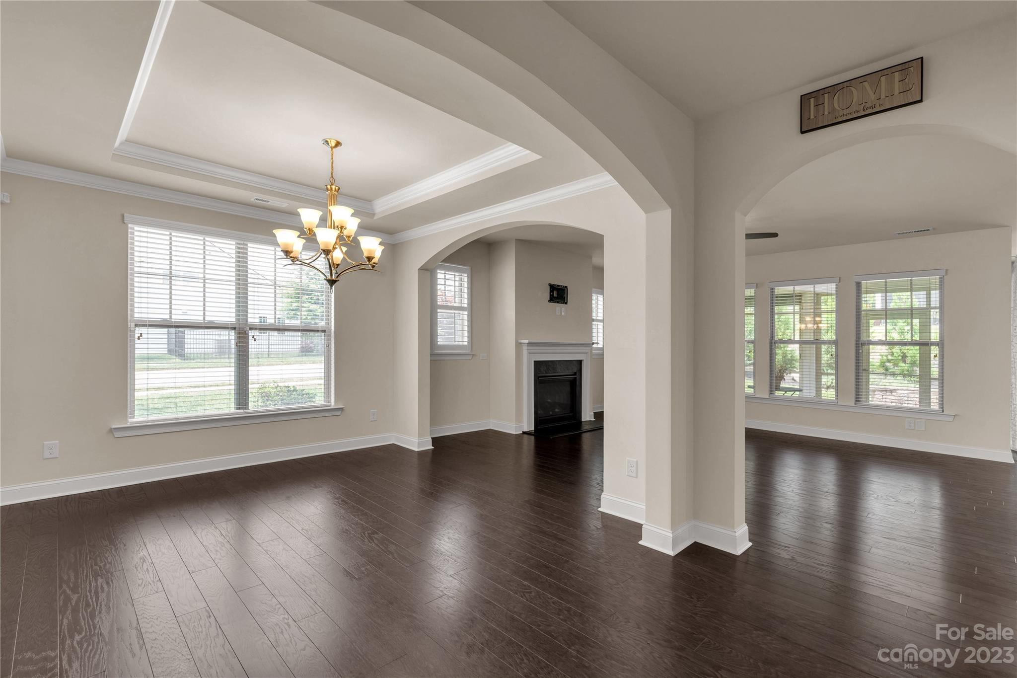 879 Pecan Tree Lane Fort Mill, SC 29715 - Photo 11 of 41 a view of an empty room with wooden floor and a window