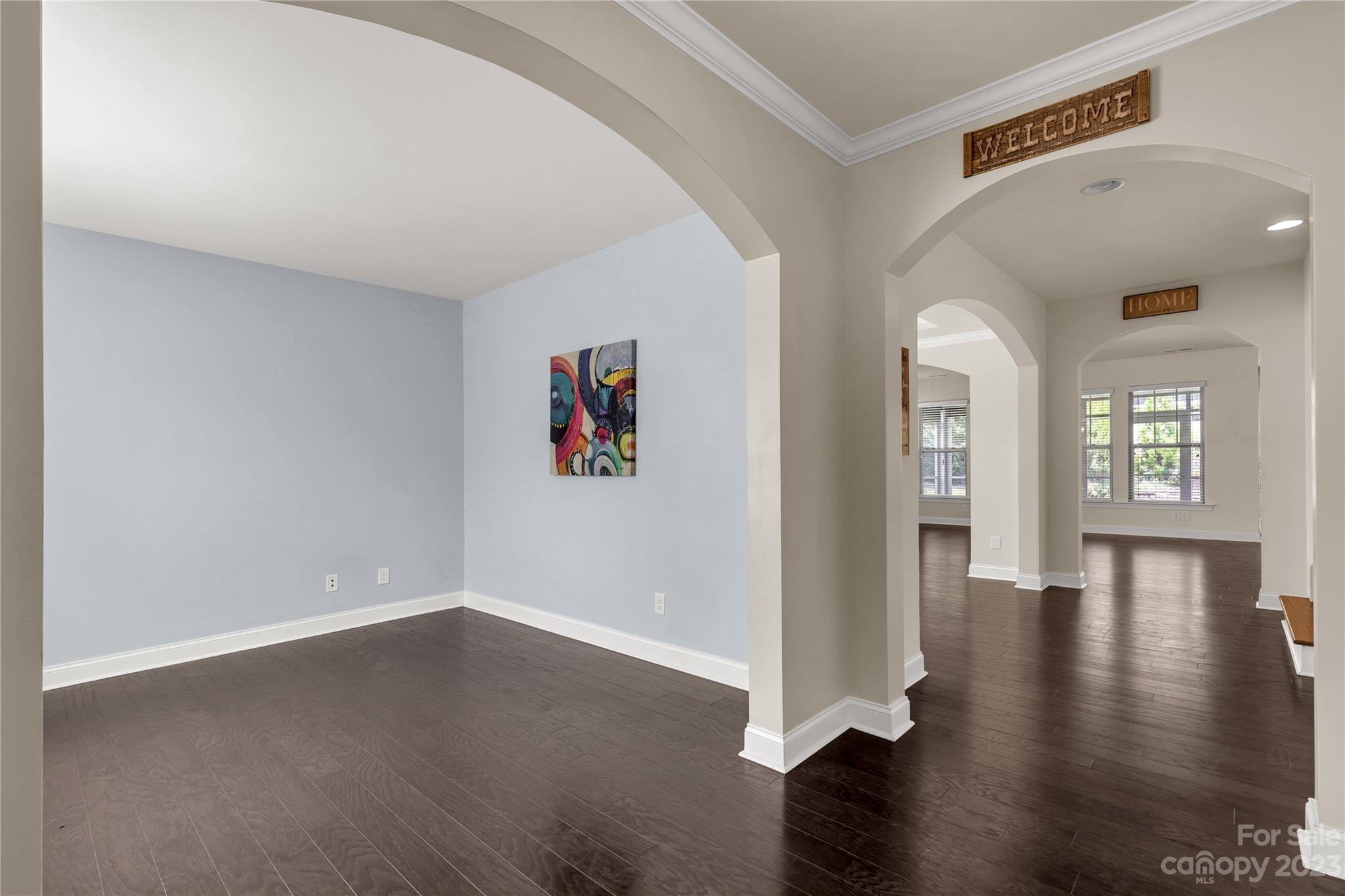 879 Pecan Tree Lane Fort Mill, SC 29715 - Photo 13 of 41 an empty room with wooden floor and windows