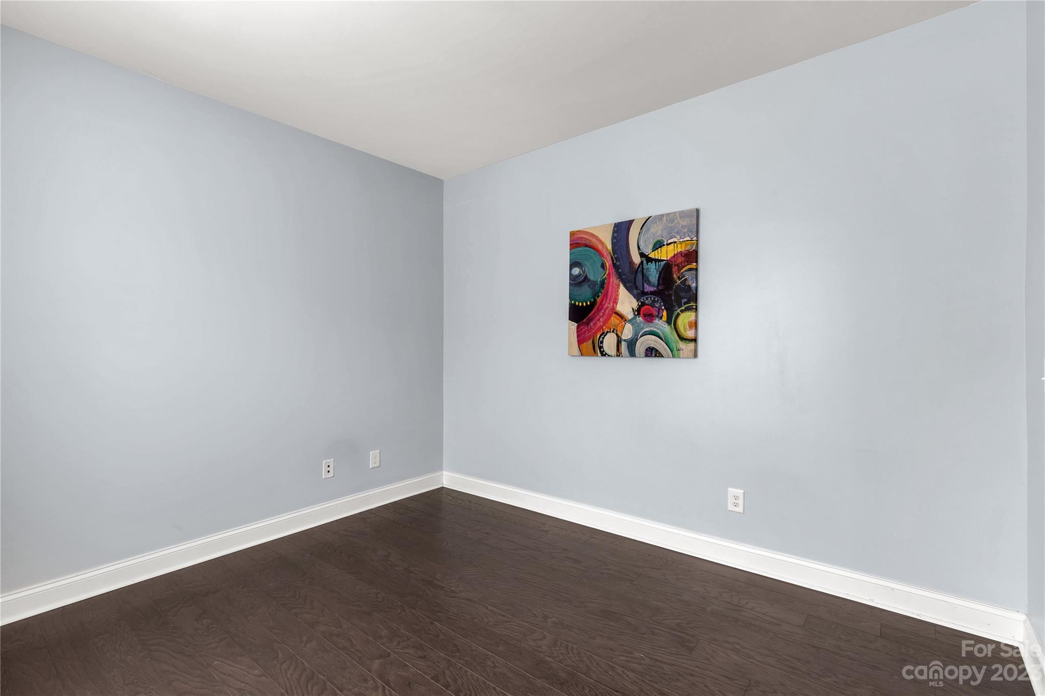 879 Pecan Tree Lane Fort Mill, SC 29715 - Photo 14 of 41 an empty room with wooden floor and wall painting