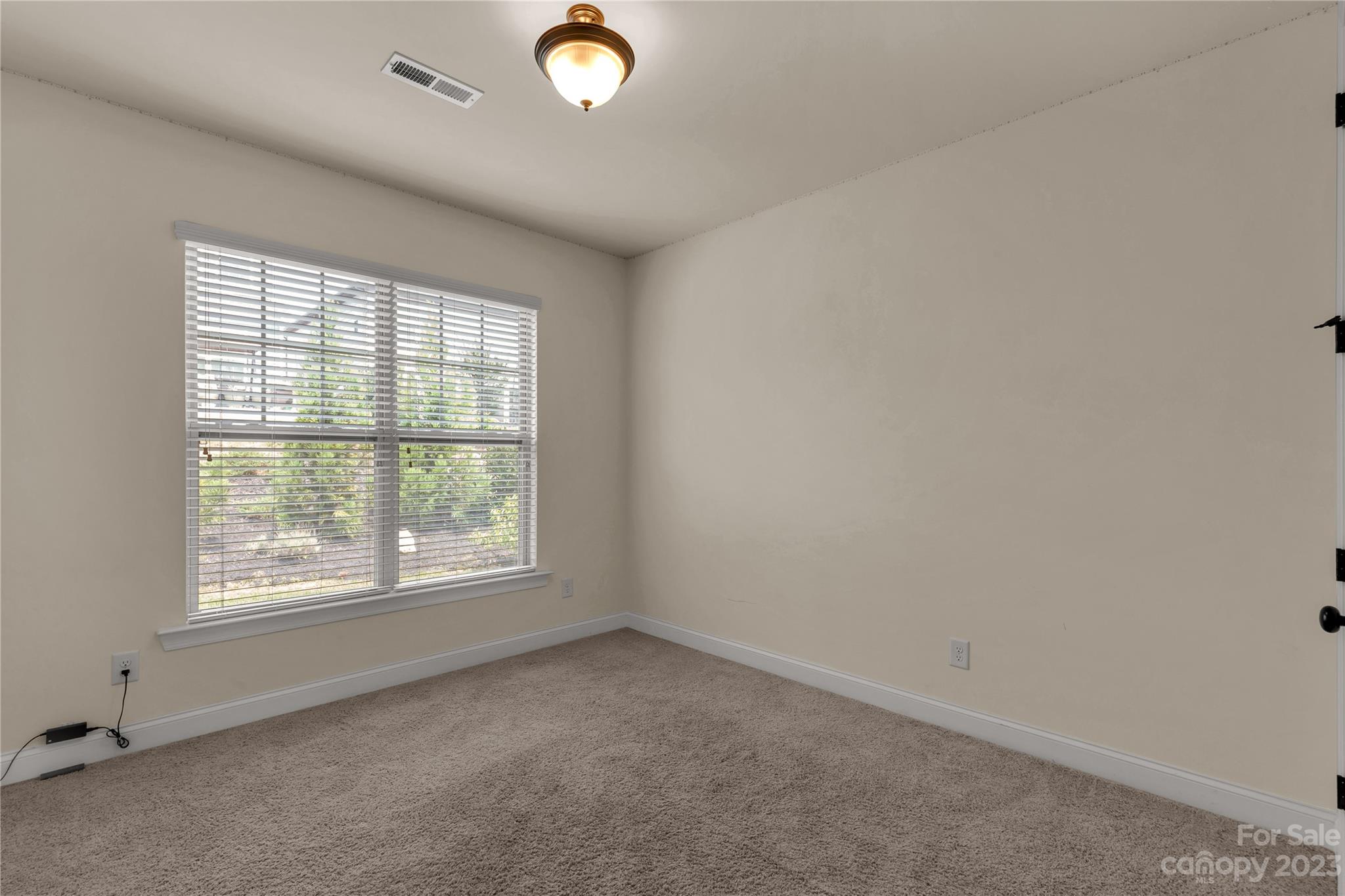 879 Pecan Tree Lane Fort Mill, SC 29715 - Photo 15 of 41 an empty room with a window