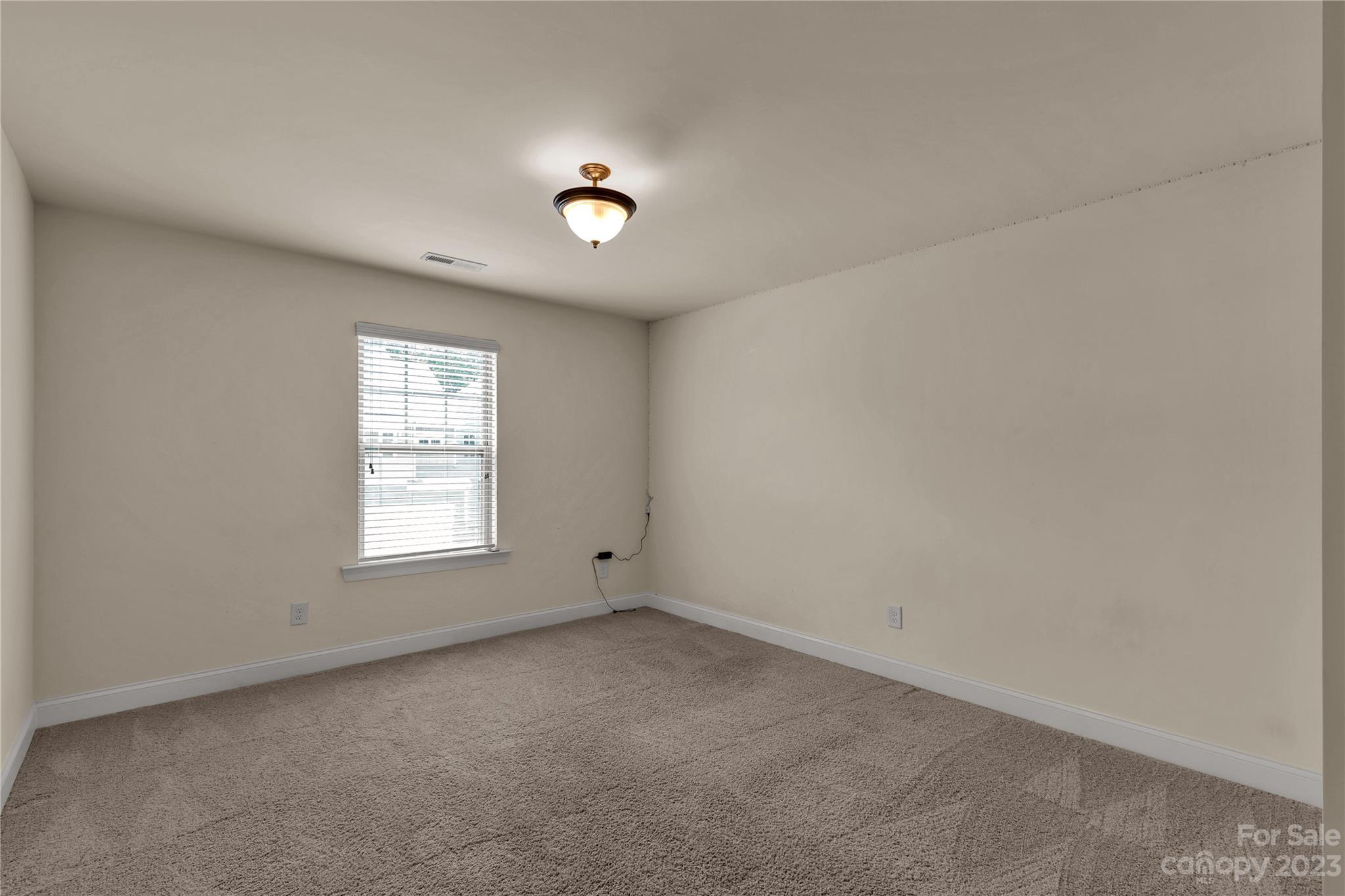 879 Pecan Tree Lane Fort Mill, SC 29715 - Photo 29 of 41 an empty room with a window