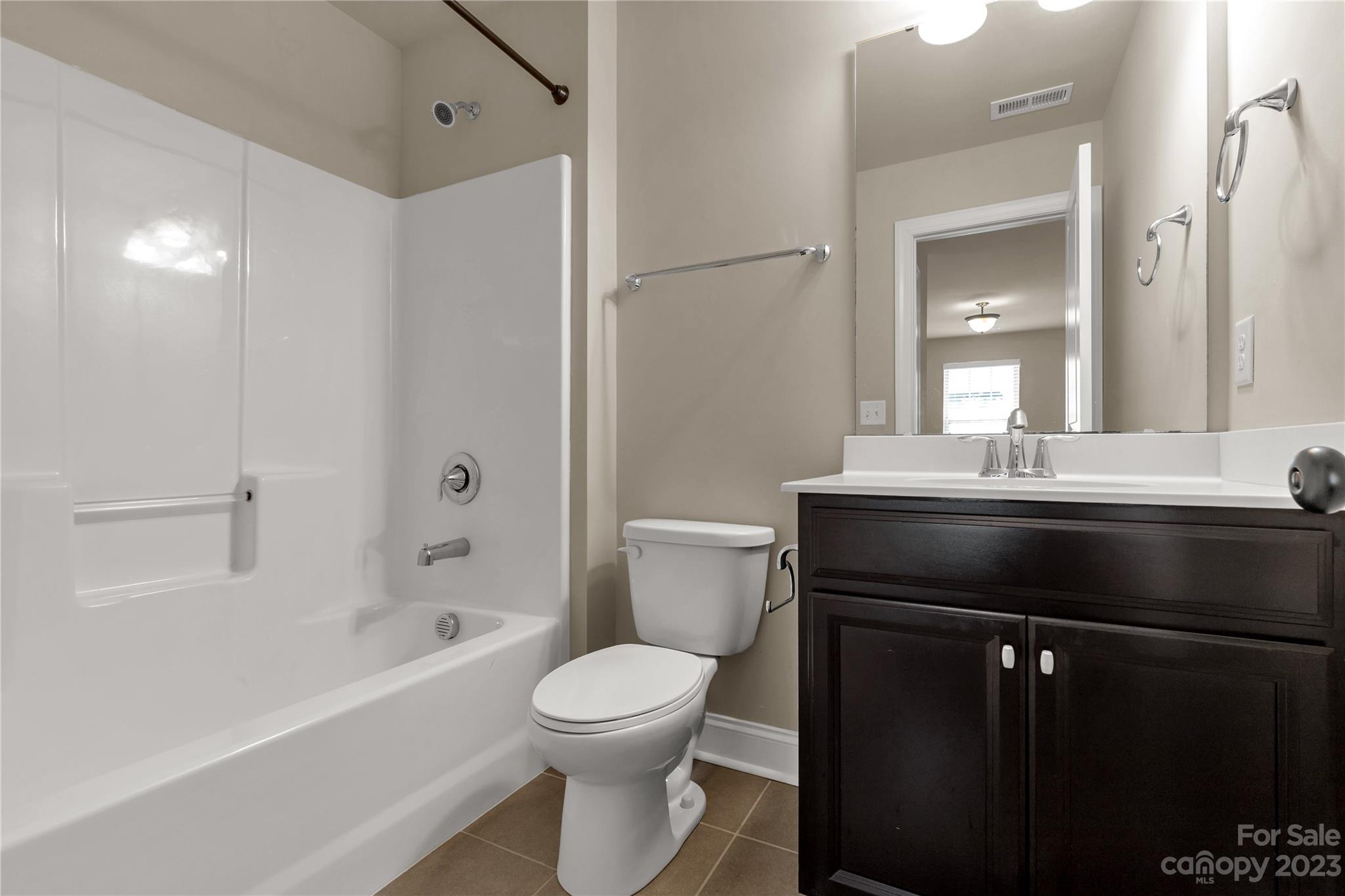 879 Pecan Tree Lane Fort Mill, SC 29715 - Photo 31 of 41 a bathroom with a sink a toilet and shower