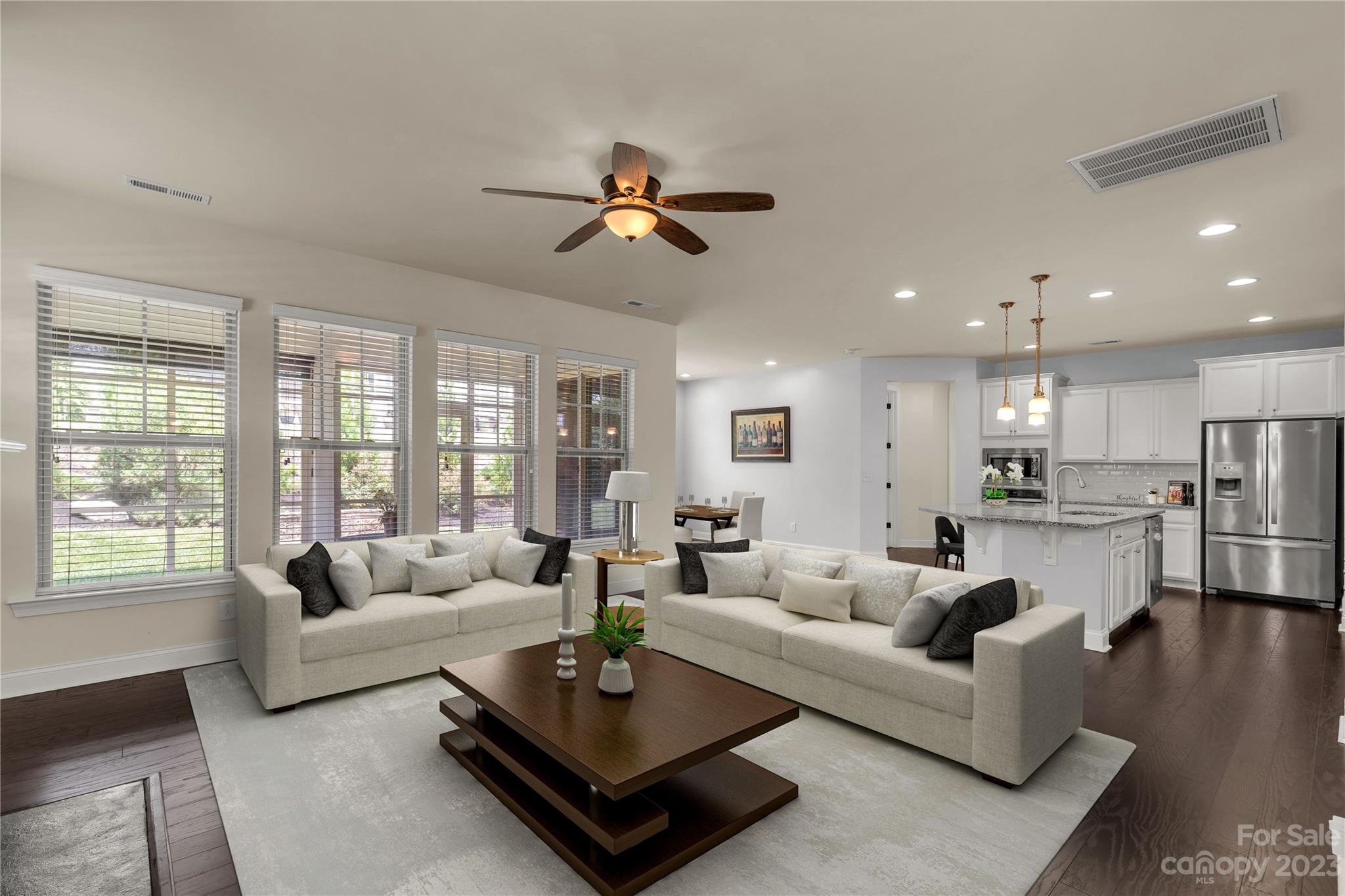 879 Pecan Tree Lane Fort Mill, SC 29715 - Photo 5 of 41 a living room with furniture kitchen view and a large window
