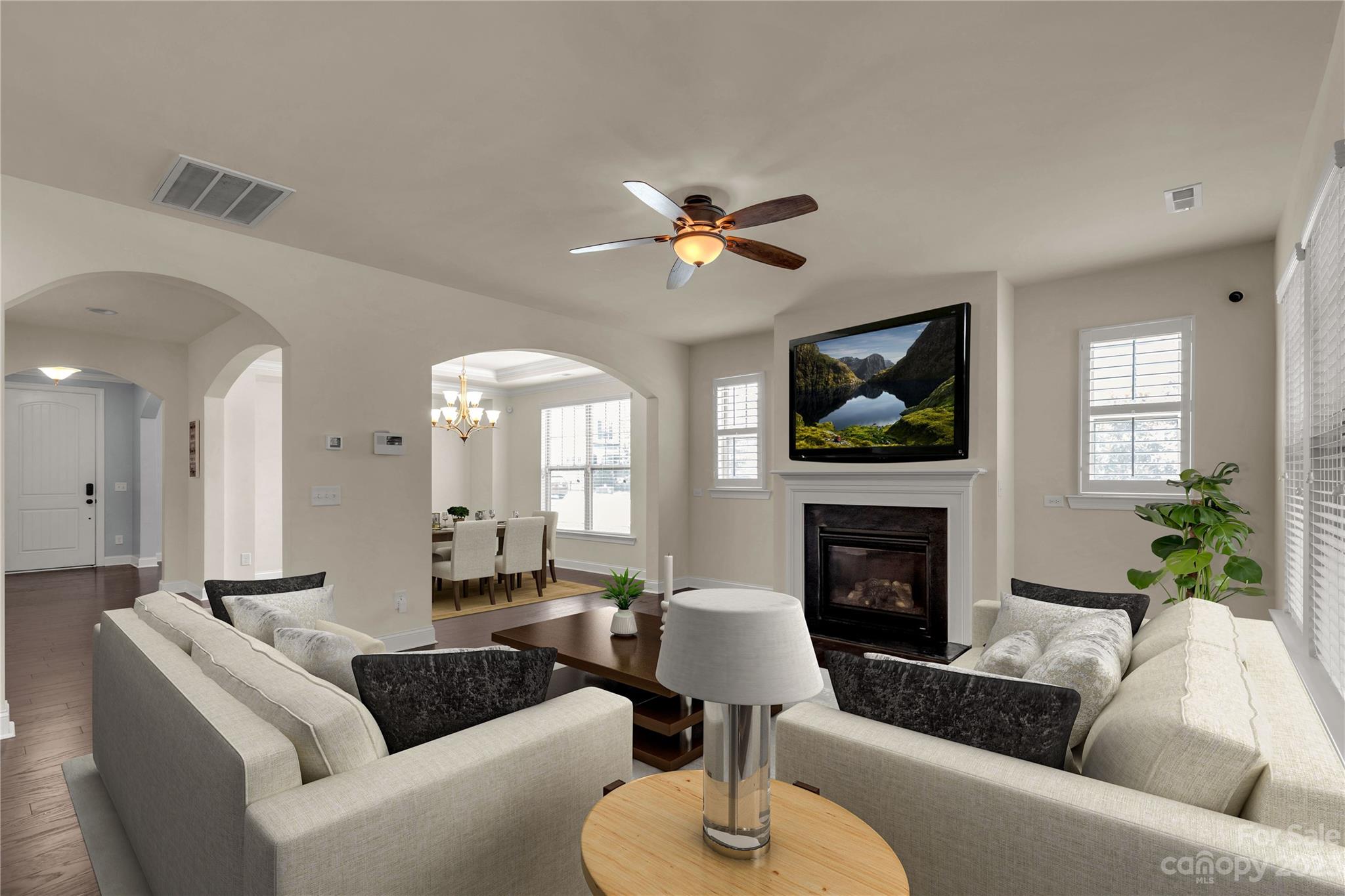 879 Pecan Tree Lane Fort Mill, SC 29715 - Photo 6 of 41 a living room with furniture a fireplace and a flat screen tv