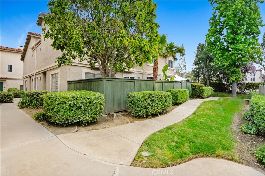 8367 Sunset Trail Place, Unit D Rancho Cucamonga, CA 91730 - Photo 1 of 1 a front view of a house with a yard