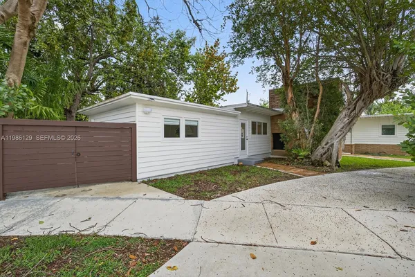 a view of a backyard of the house