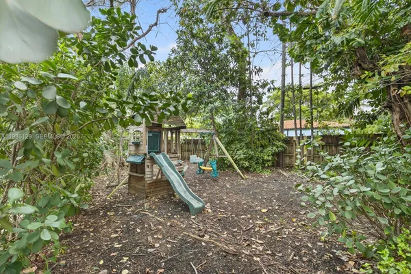 a view of a park with a slide