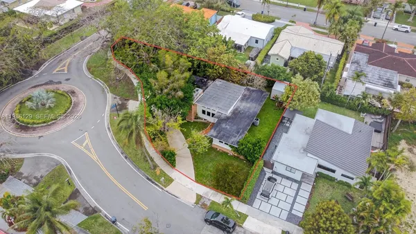 an aerial view of a house with outdoor space