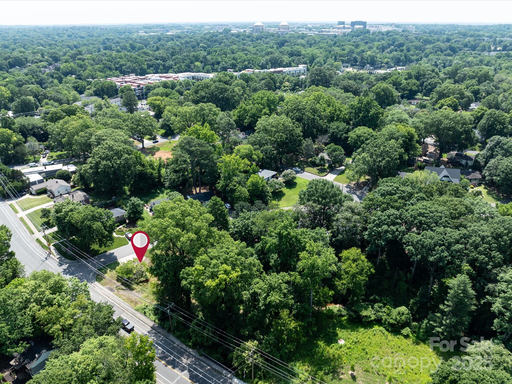 4800 Valley Stream Road Charlotte, NC 28209 - Photo 11 of 16 an aerial view of residential house with outdoor space and trees all around