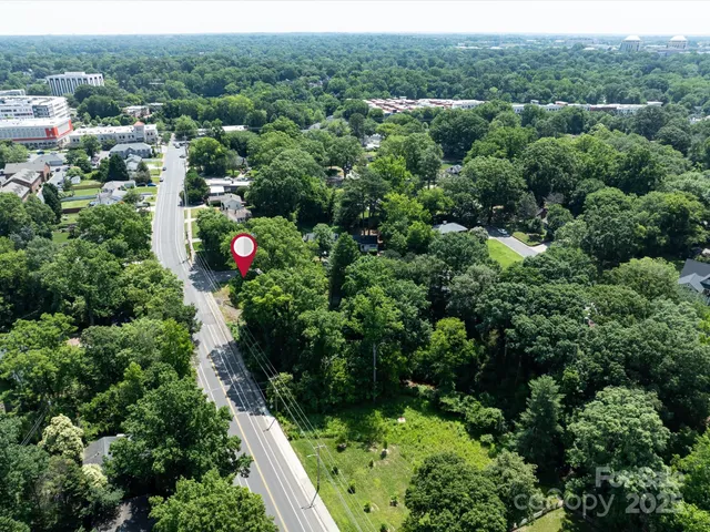 an aerial view of residential house with outdoor space and street view