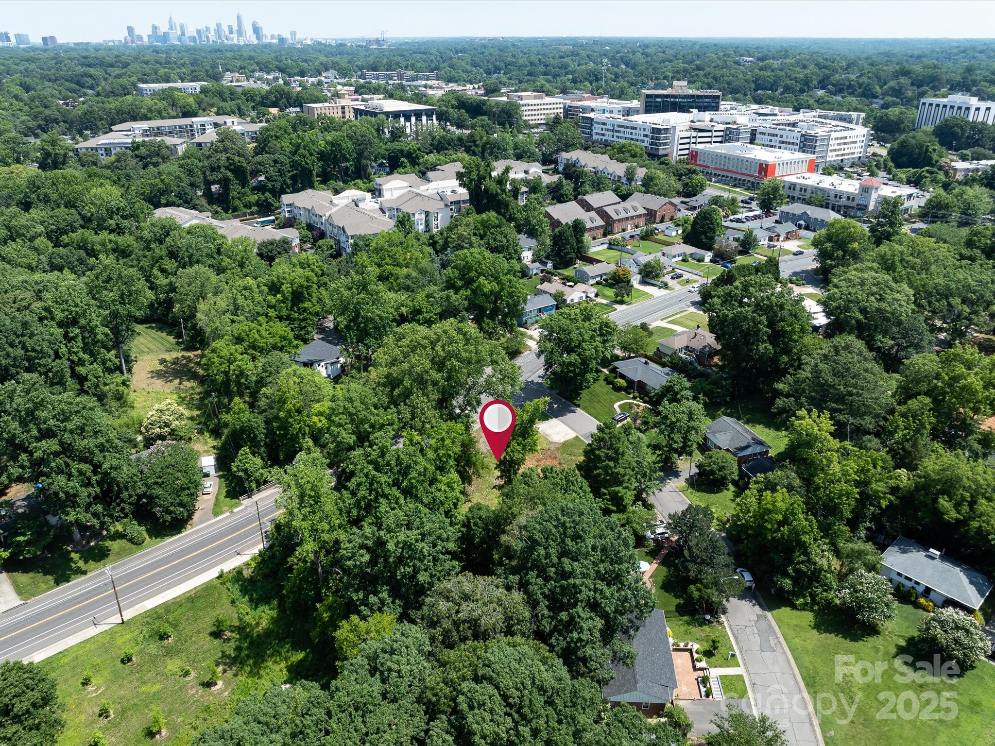 4800 Valley Stream Road Charlotte, NC 28209 - Photo 14 of 16 an aerial view of residential house with outdoor space and trees