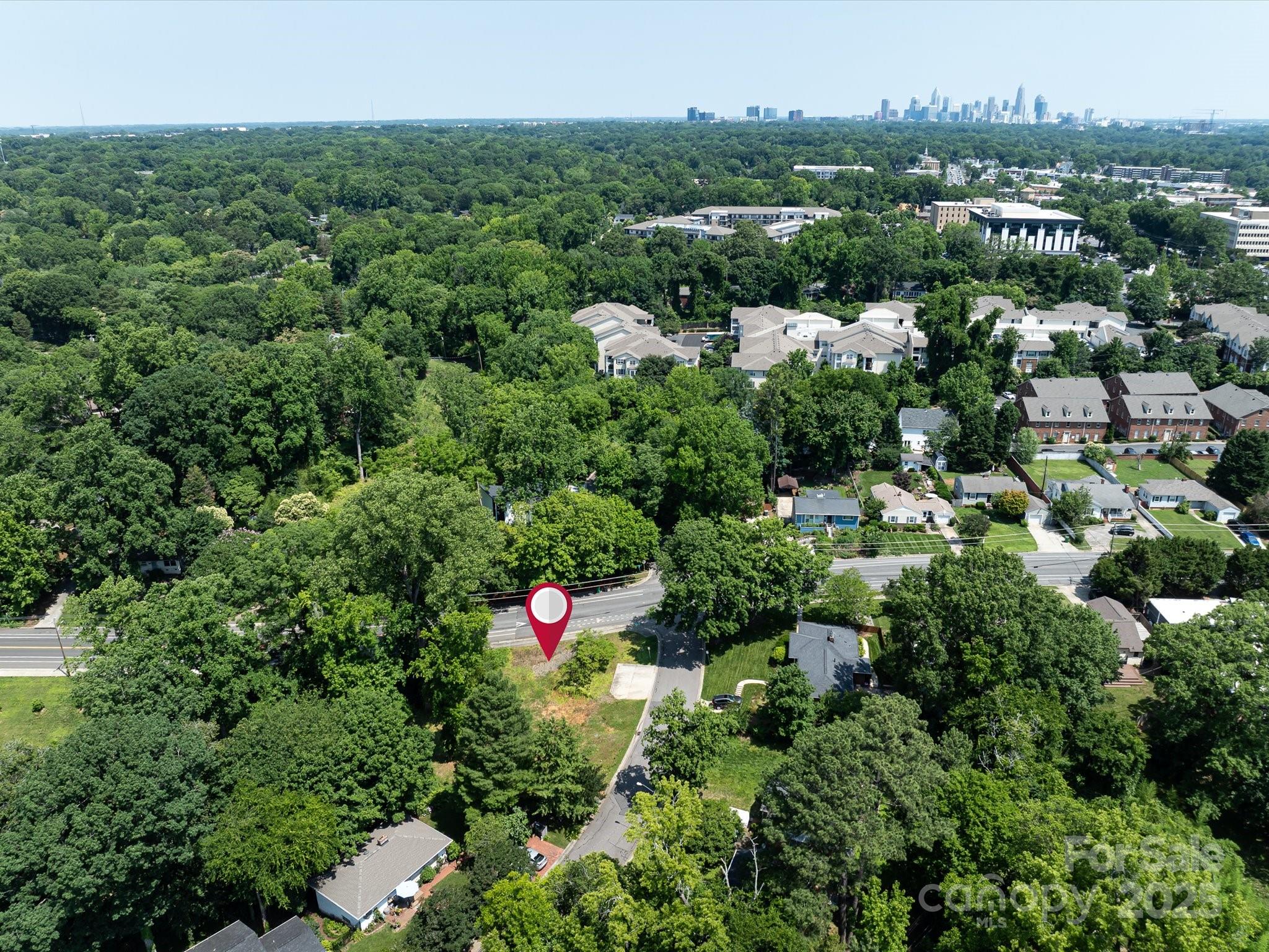 4800 Valley Stream Road Charlotte, NC 28209 - Photo 15 of 16 a view of a house with a street