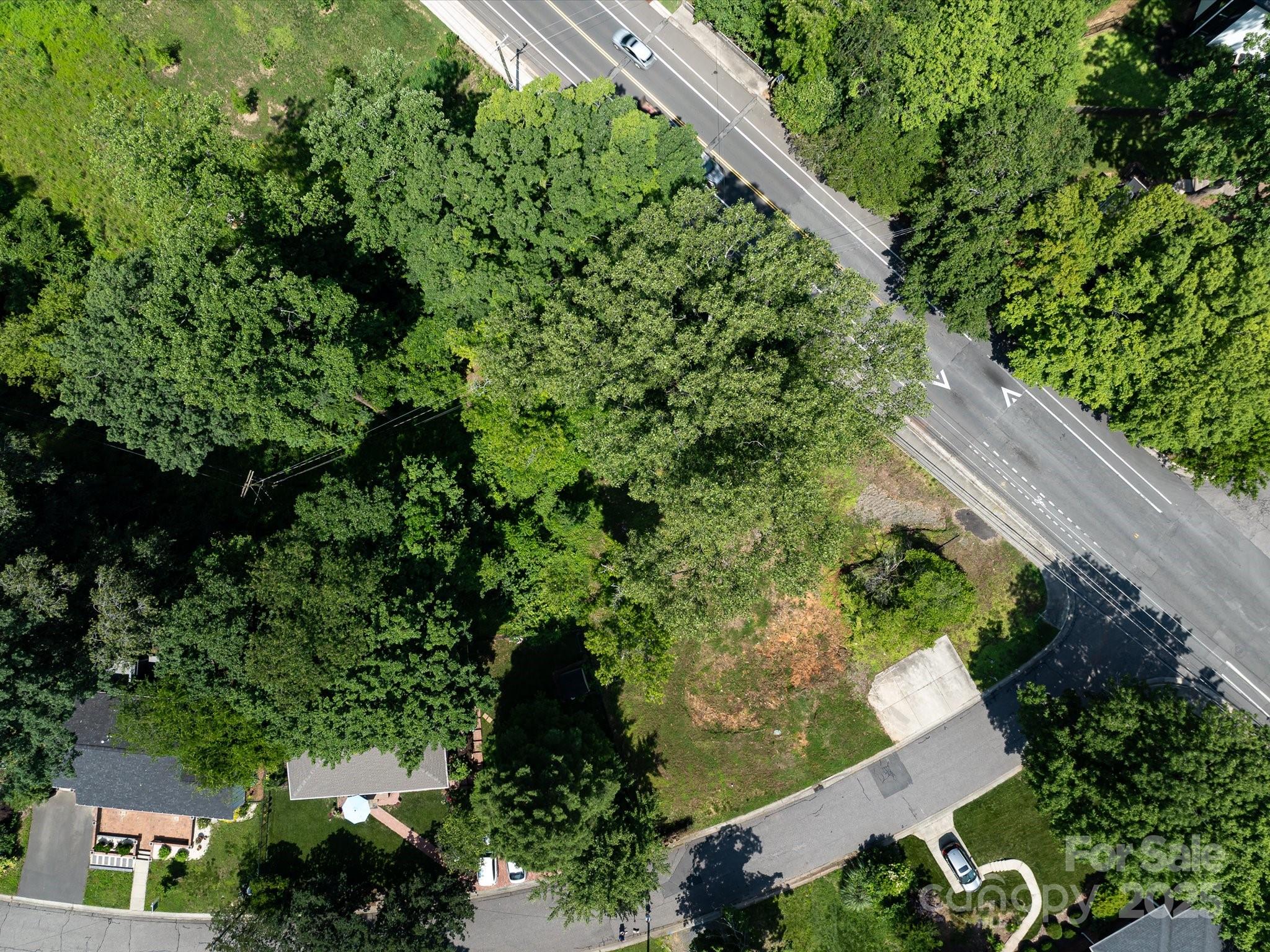 4800 Valley Stream Road Charlotte, NC 28209 - Photo 6 of 16 an aerial view of a house with a yard