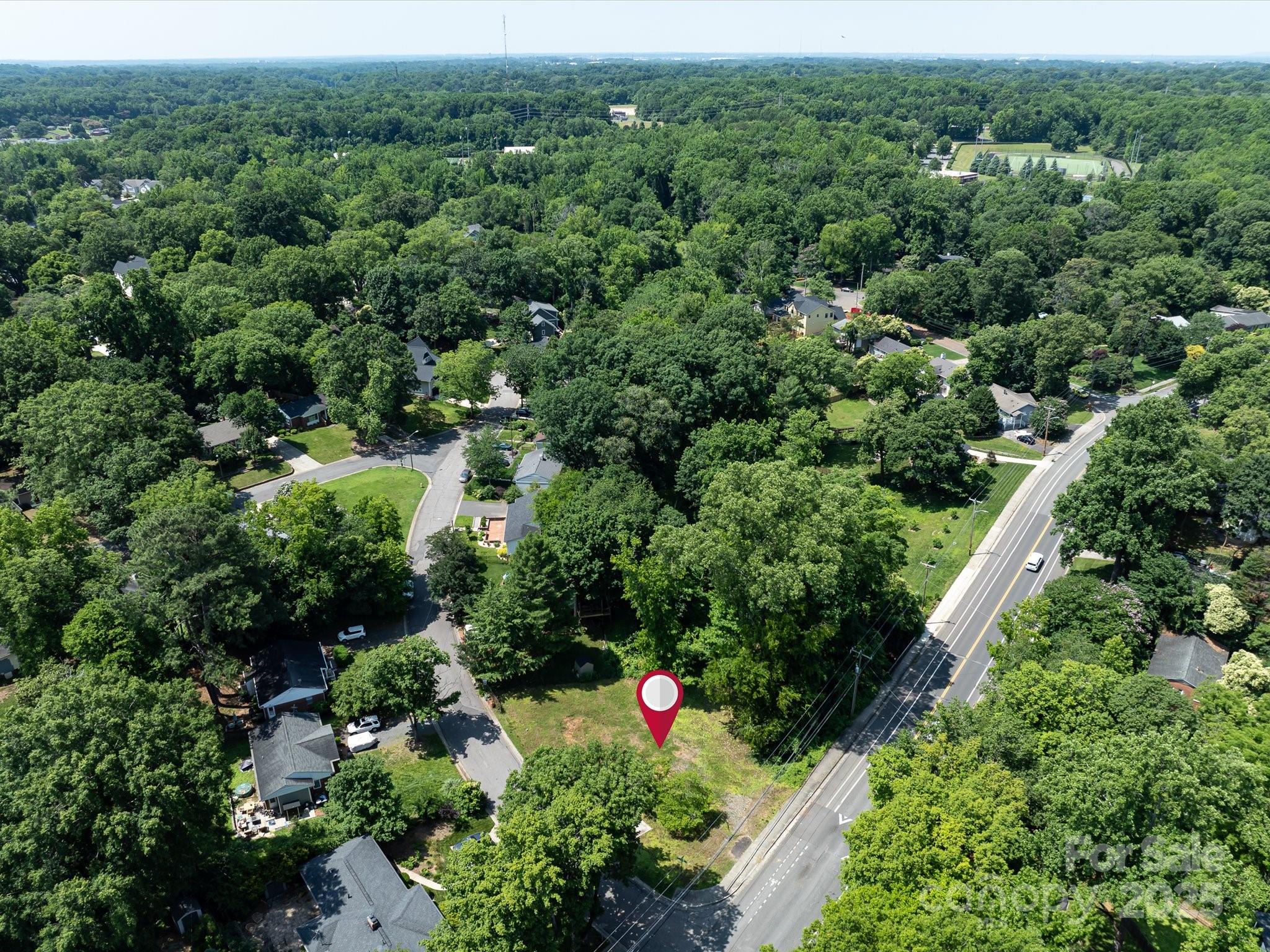 4800 Valley Stream Road Charlotte, NC 28209 - Photo 8 of 16 an aerial view of residential house with outdoor space and street view
