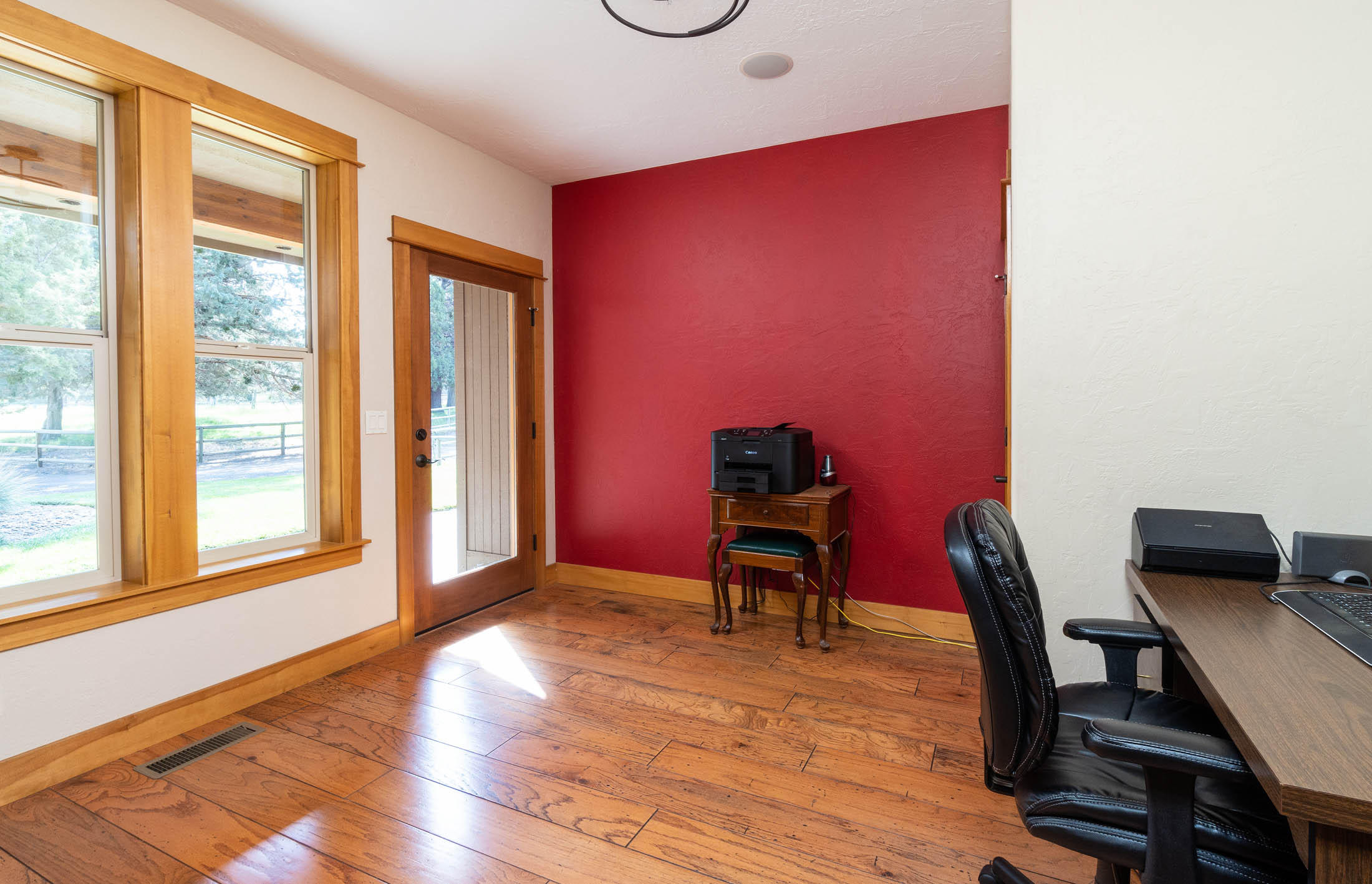 63575 Cricketwood Road Bend, OR 97701 - Photo 19 of 53 a view of a workspace with furniture and a window