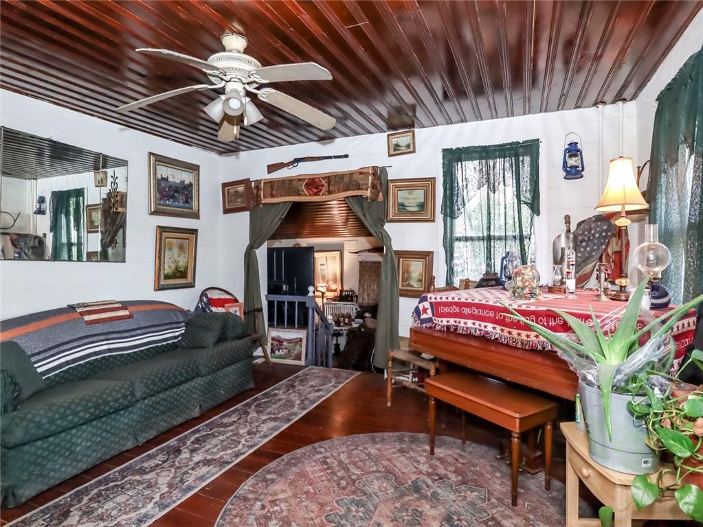 636 Holmdel Road Hazlet, NJ 07730 - Photo 8 of 47 a bedroom with a bed next to a window and a chandelier