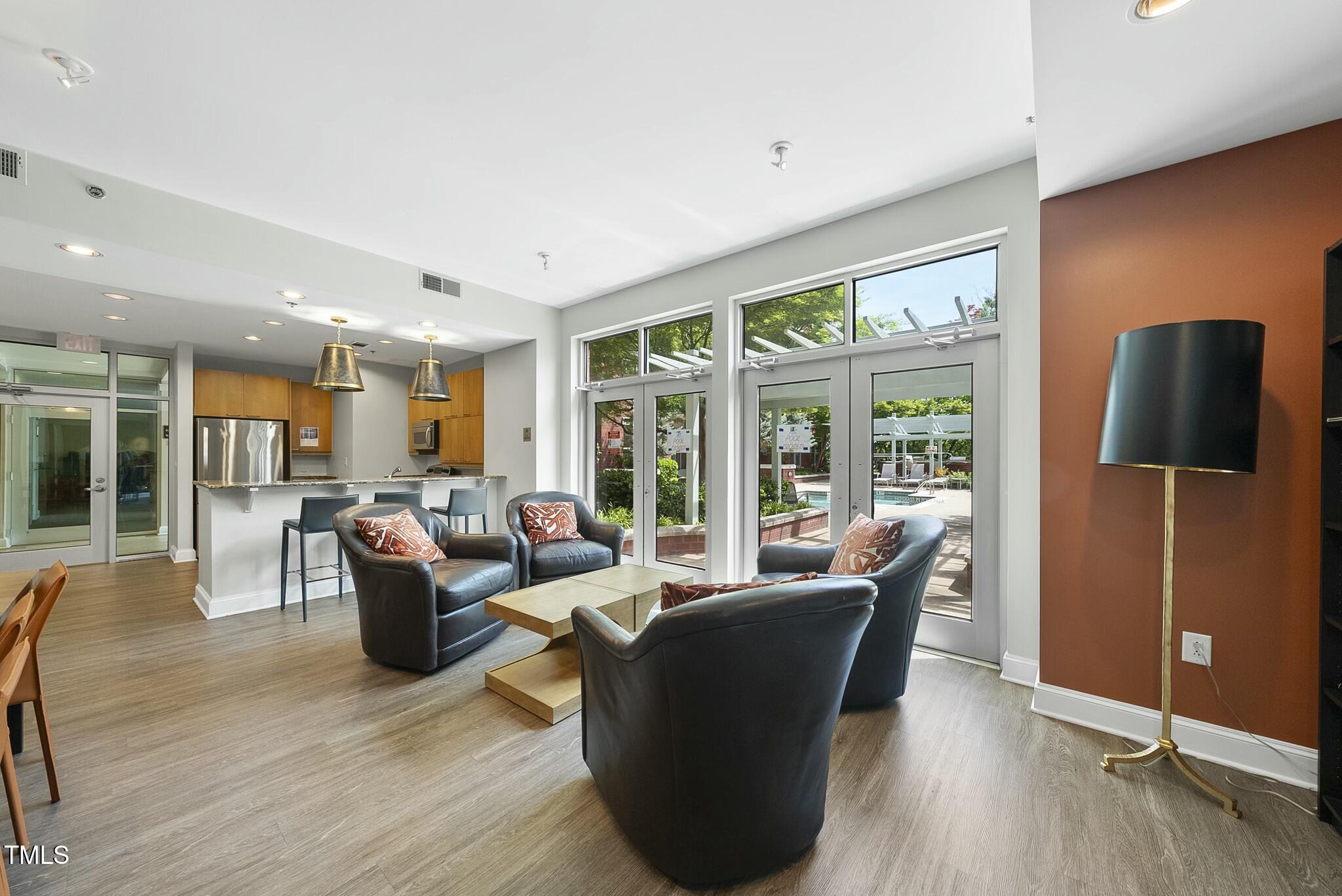 618 North Boylan Avenue, Unit 400 Raleigh, NC 27603 - Photo 20 of 28 a living room with furniture and wooden floor