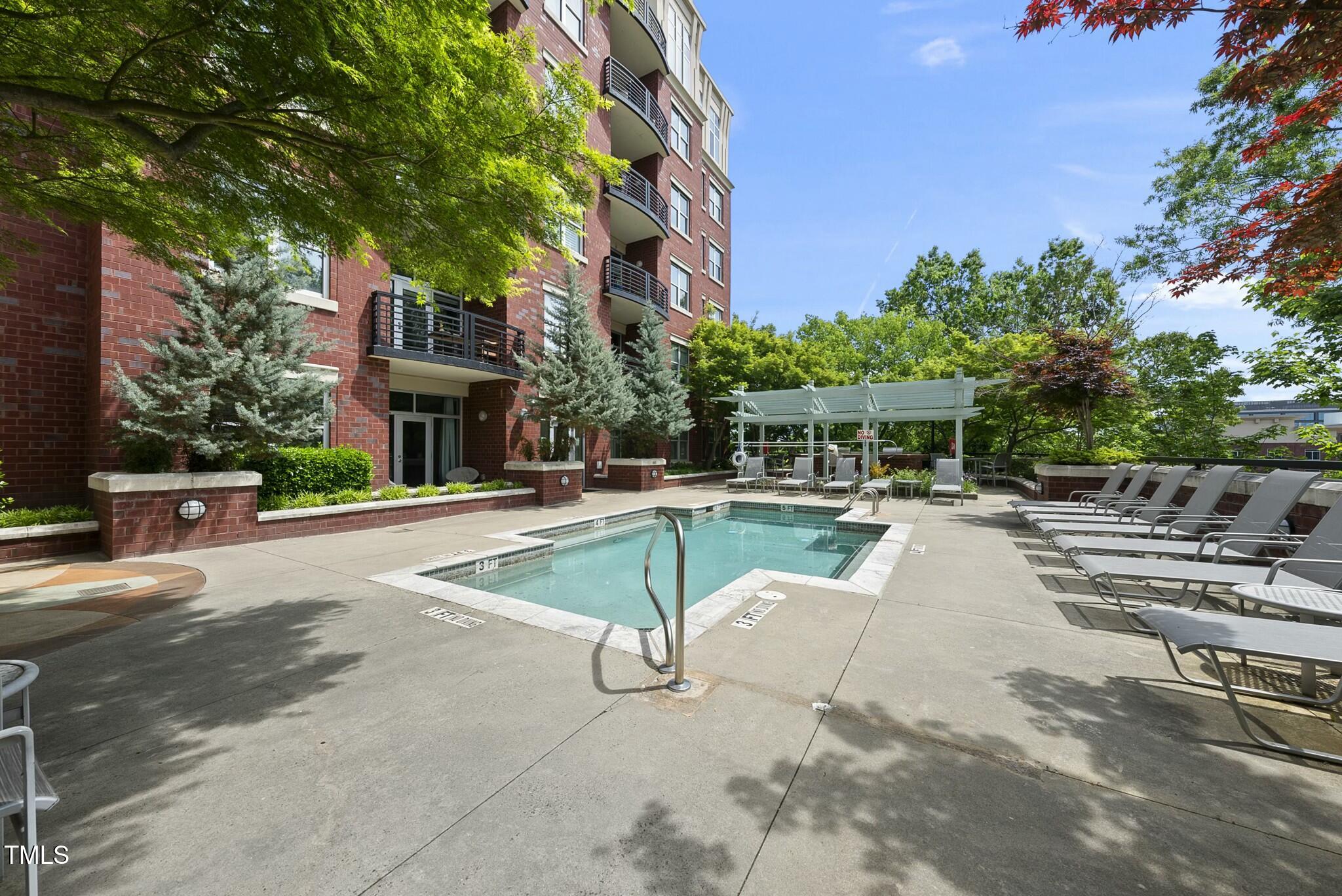 618 North Boylan Avenue, Unit 400 Raleigh, NC 27603 - Photo 21 of 28 a view of a swimming pool with a patio