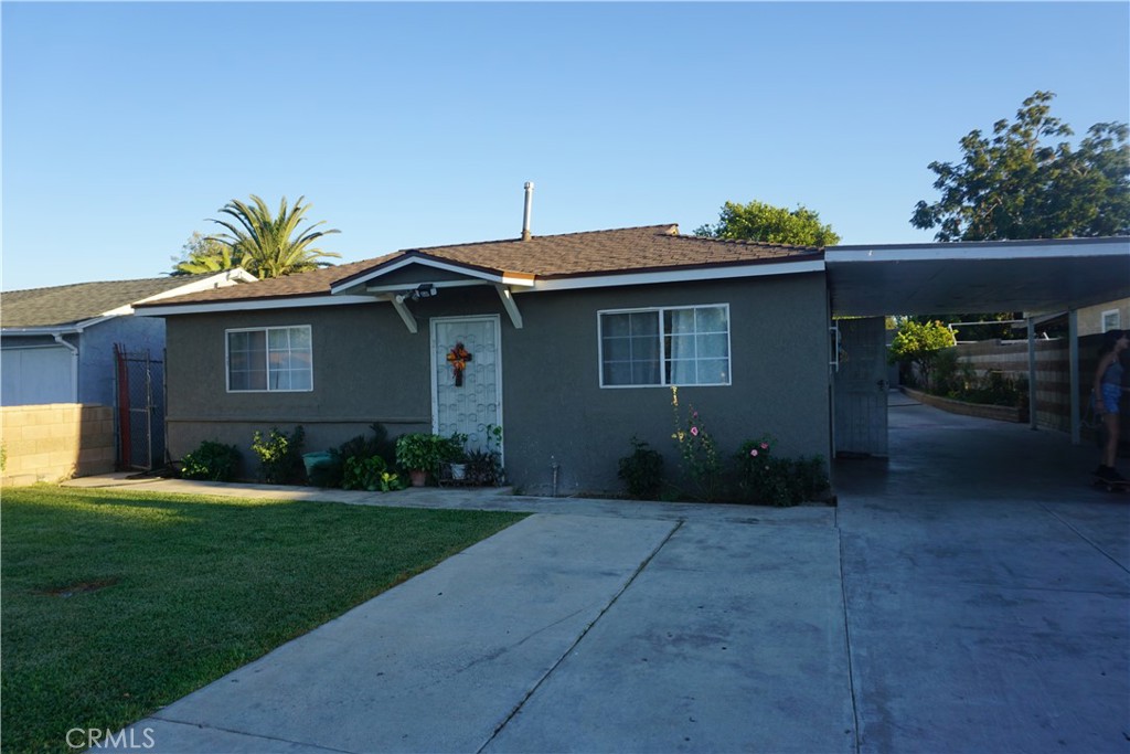 8390 Trey Avenue Riverside, CA 92503 - Photo 1 of 1 a backyard of a house with table and chairs