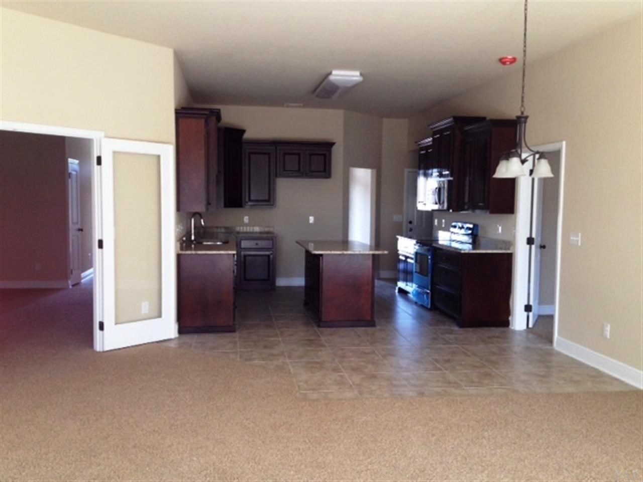 9967 Nichols Lake Road Milton, FL 32583 - Photo 11 of 26 View of kitchen from Florida room.