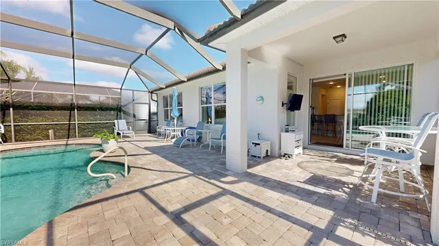 a view of a backyard with porch and furniture