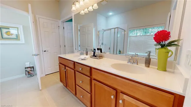 a bathroom with a sink double vanity and a mirror