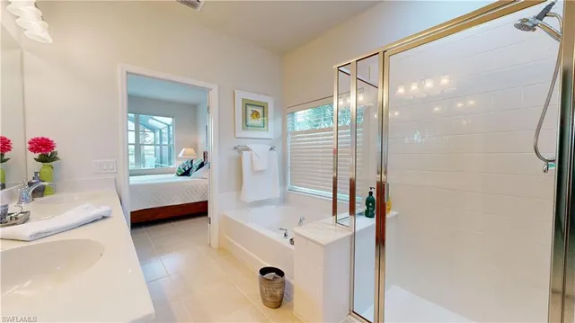 a view of walk in closet with clothes