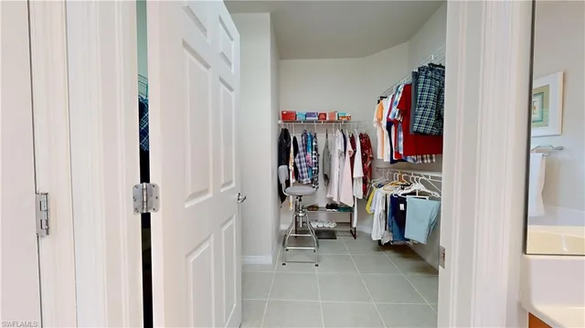 a bedroom with a bed dresser and a window