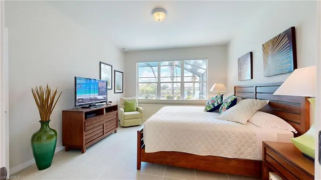 a bedroom with a bed and a table in it