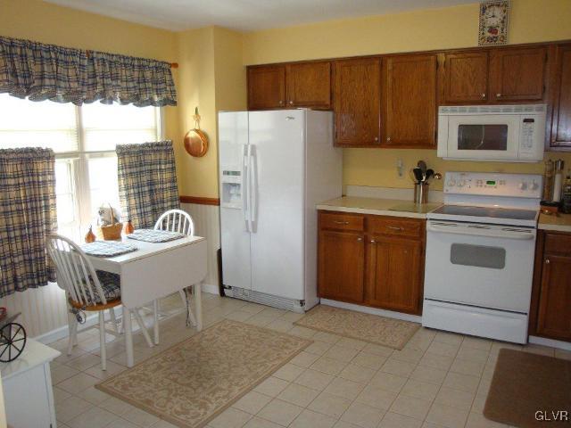 223 Flint Hill Road Alburtis, PA 18011 - Photo 4 of 23 Kitchen with Tile Floor, Refrigerator, Smooth Top