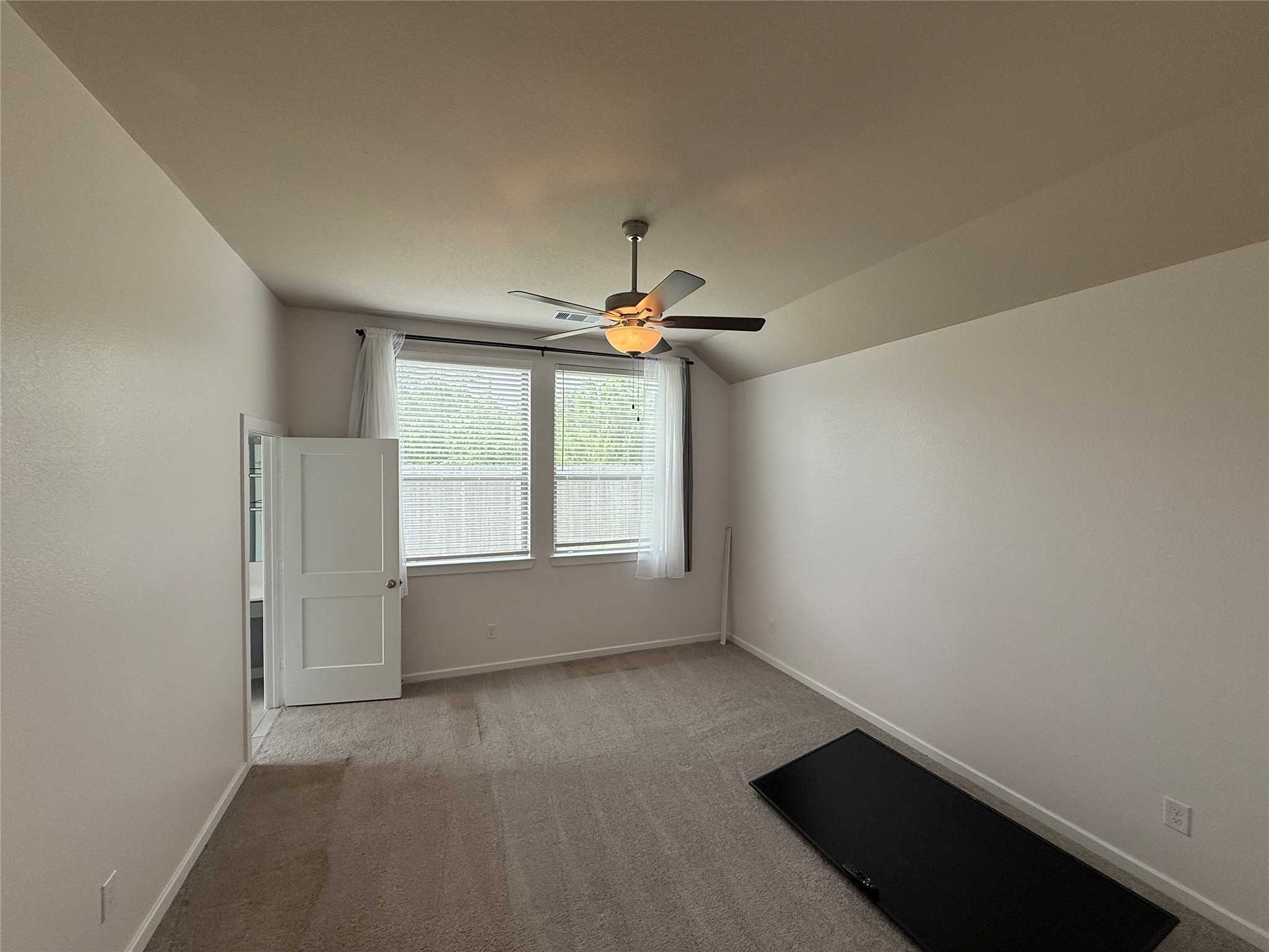 10534 Wild Chives Conroe, TX 77385 - Photo 12 of 24 an empty room with a window