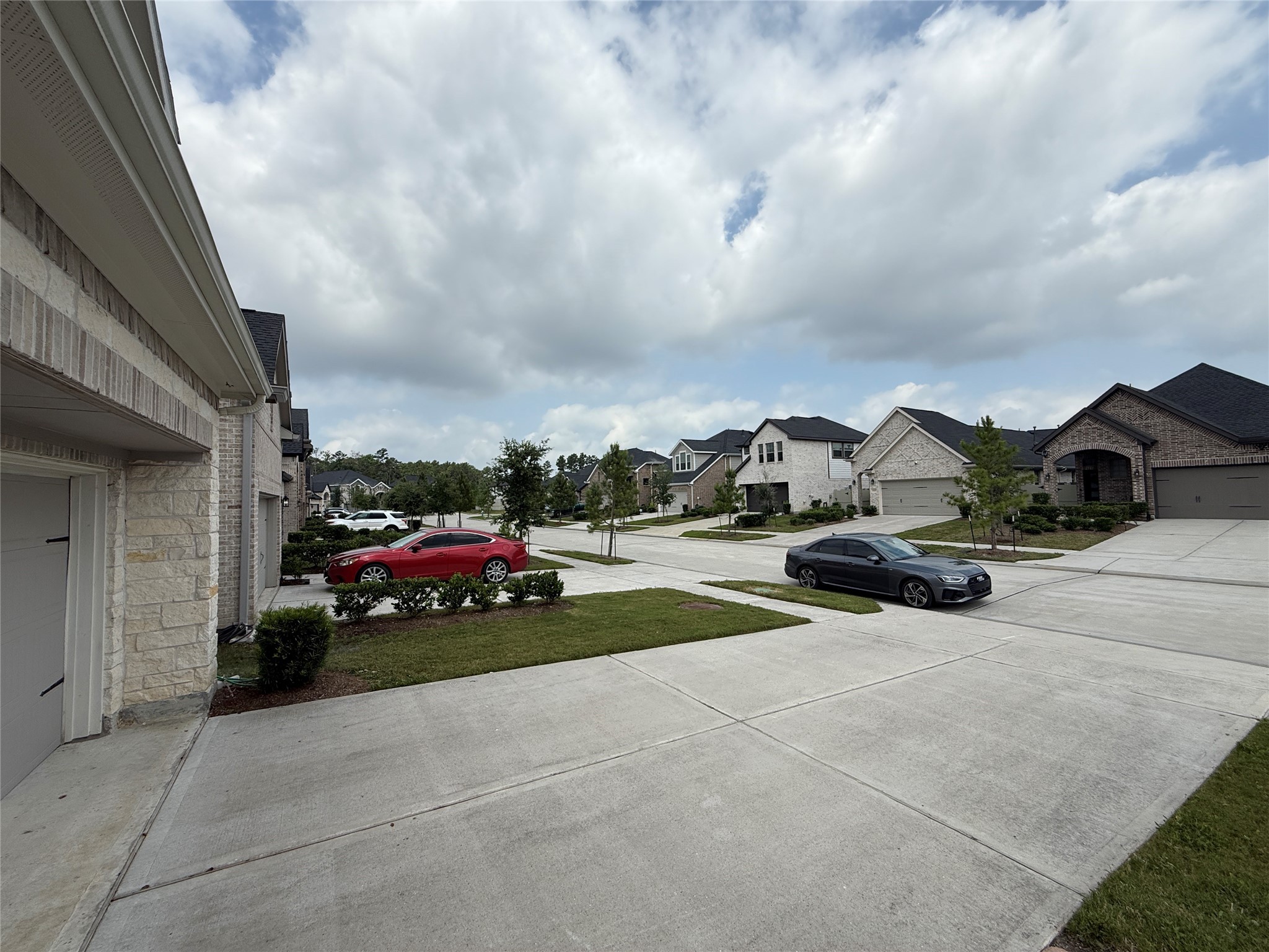 10534 Wild Chives Conroe, TX 77385 - Photo 23 of 24 a view of car parked in front of a building