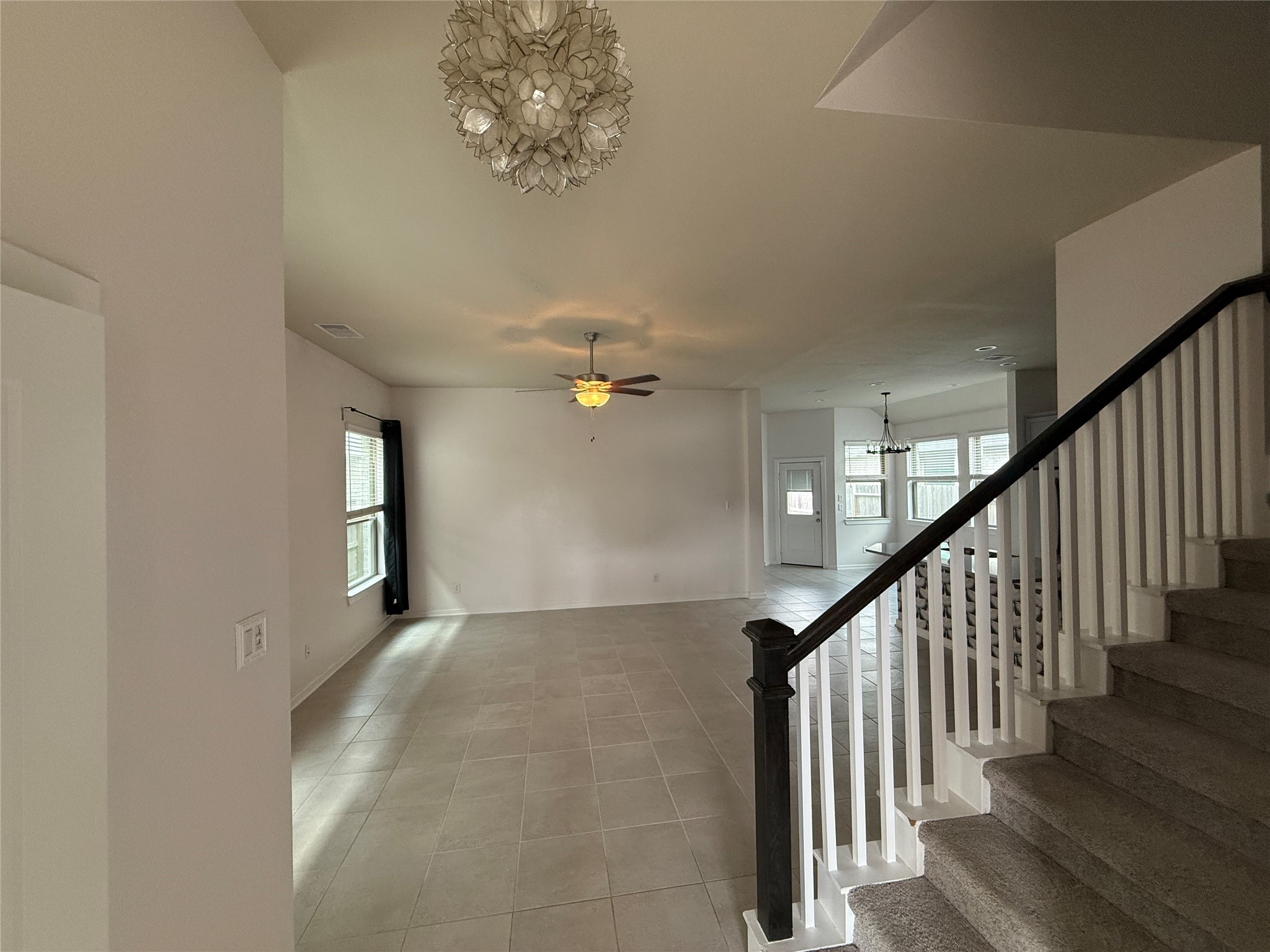 10534 Wild Chives Conroe, TX 77385 - Photo 3 of 24 wooden floor in an empty room with a window